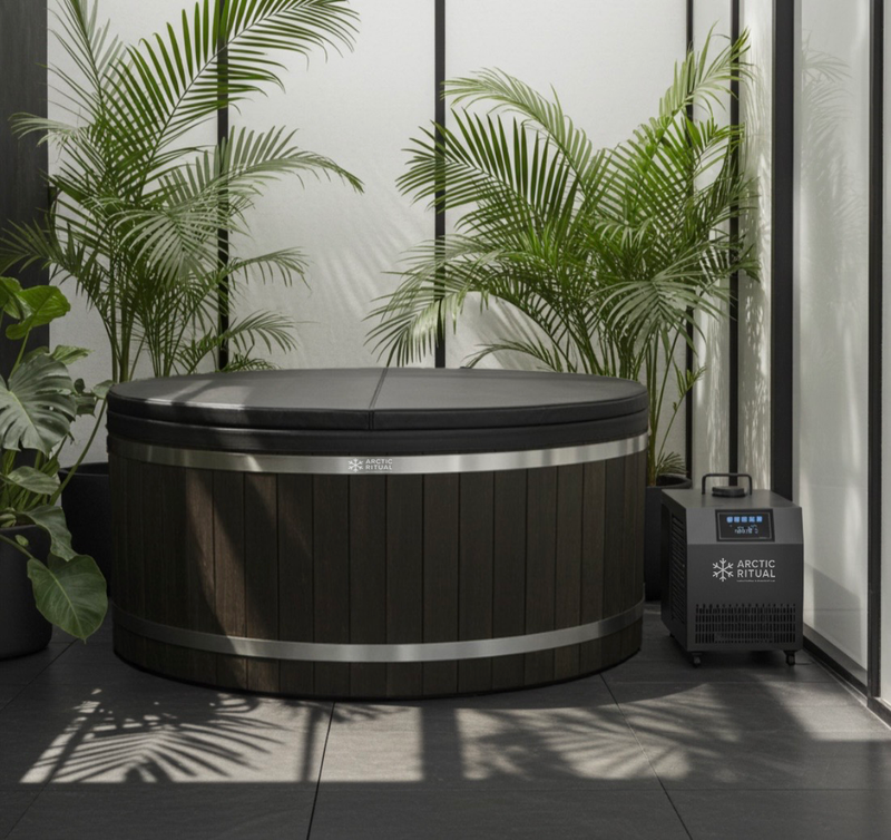 Arctic Ritual black cedar cold plunge tub with insulated lid and ArcticFlow™ chiller, set in a modern indoor wellness space