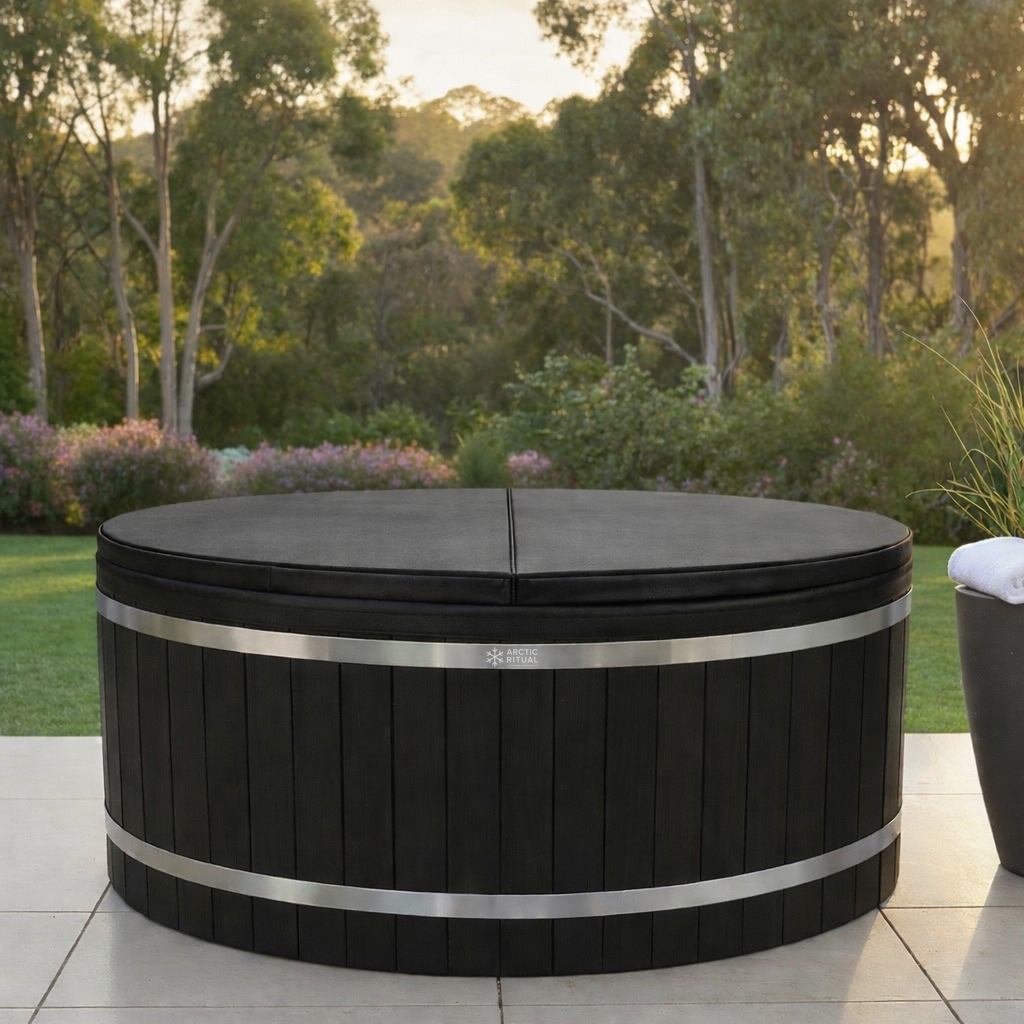 Black and stainless steel cedar cold plunge tub with insulated lid by Arctic Ritual, designed for outdoor recovery and ice bath therapy