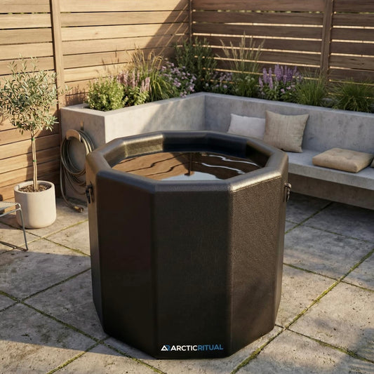 Arctic Ritual Lite+ Barrel cold plunge tub filled with water installed outdoors on patio for ice bath recovery