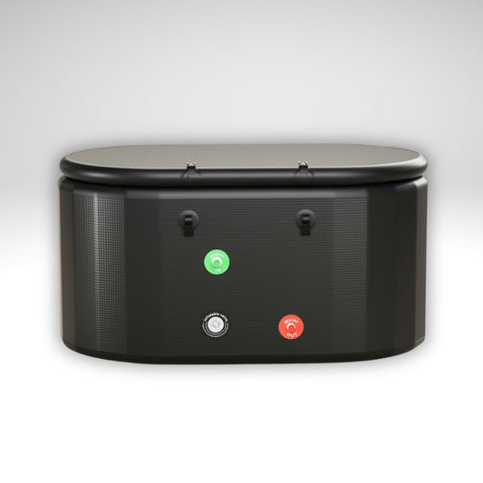 Rear view of Arctic Ritual Lite+ cold plunge tub in black showing water inlet and outlet connection ports in a clean studio setting