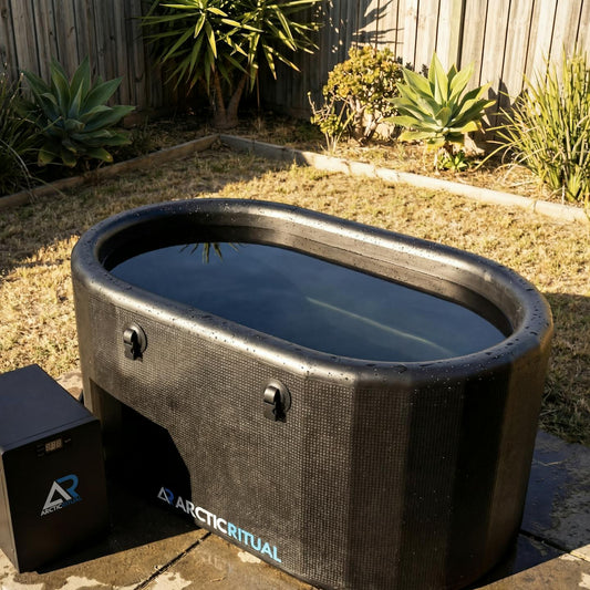 Arctic Ritual Lite+ cold plunge system with black inflatable tub and ArcticFlow chiller set up outdoors in a backyard recovery space